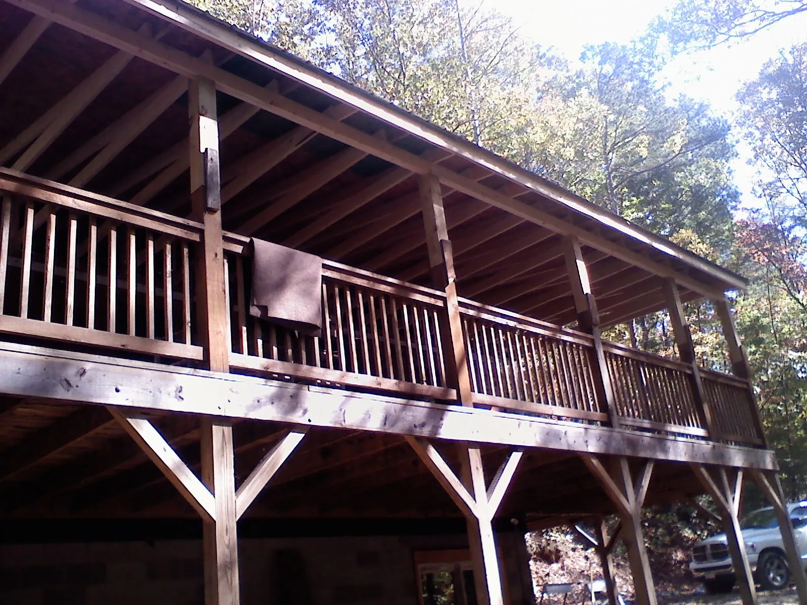 Timber framing under a new elevated porch and deck — Roof Leak Repair in Lawrence by Roofing Brothers